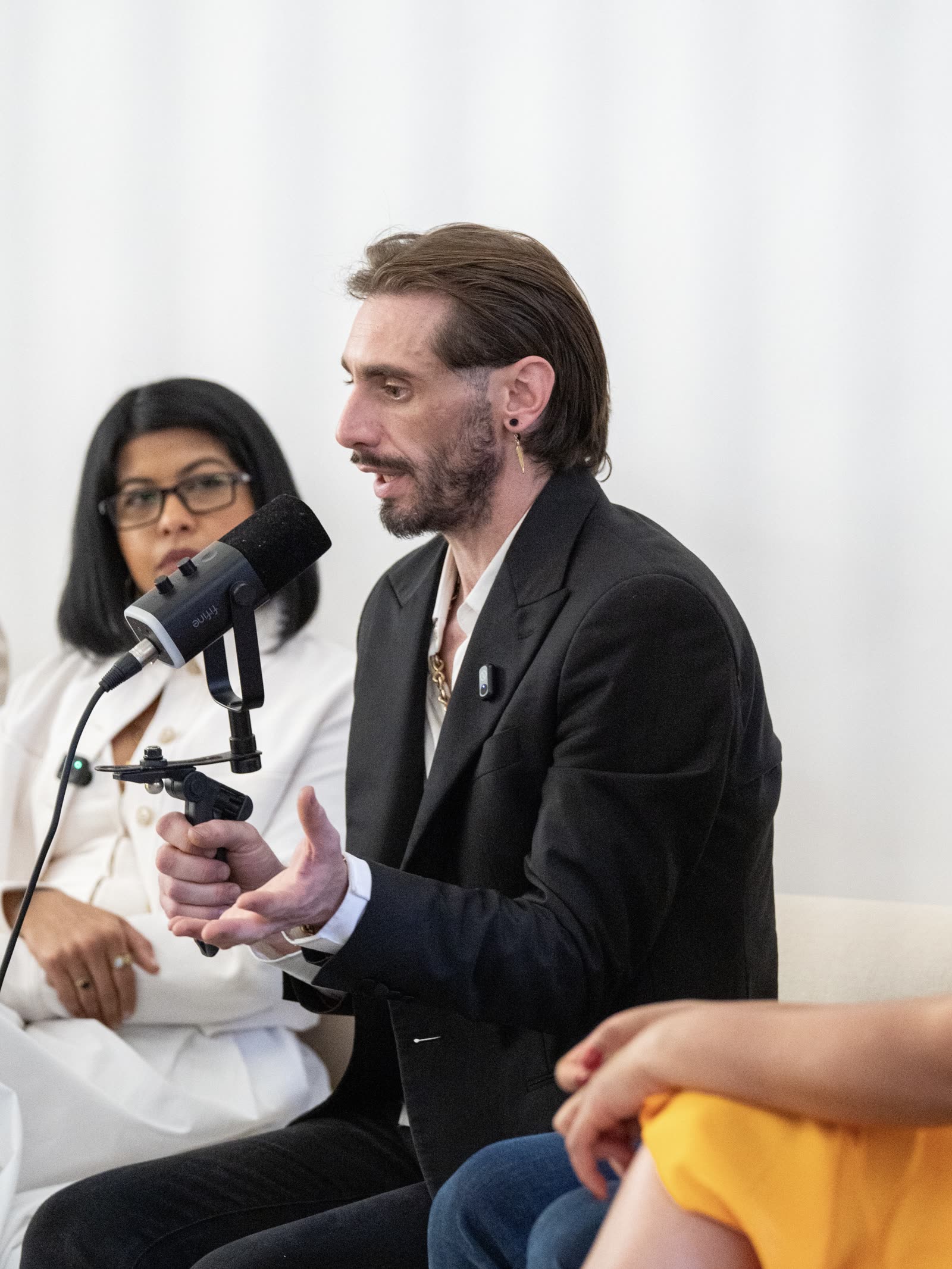 Panel speakers in conversation at the Impact Room