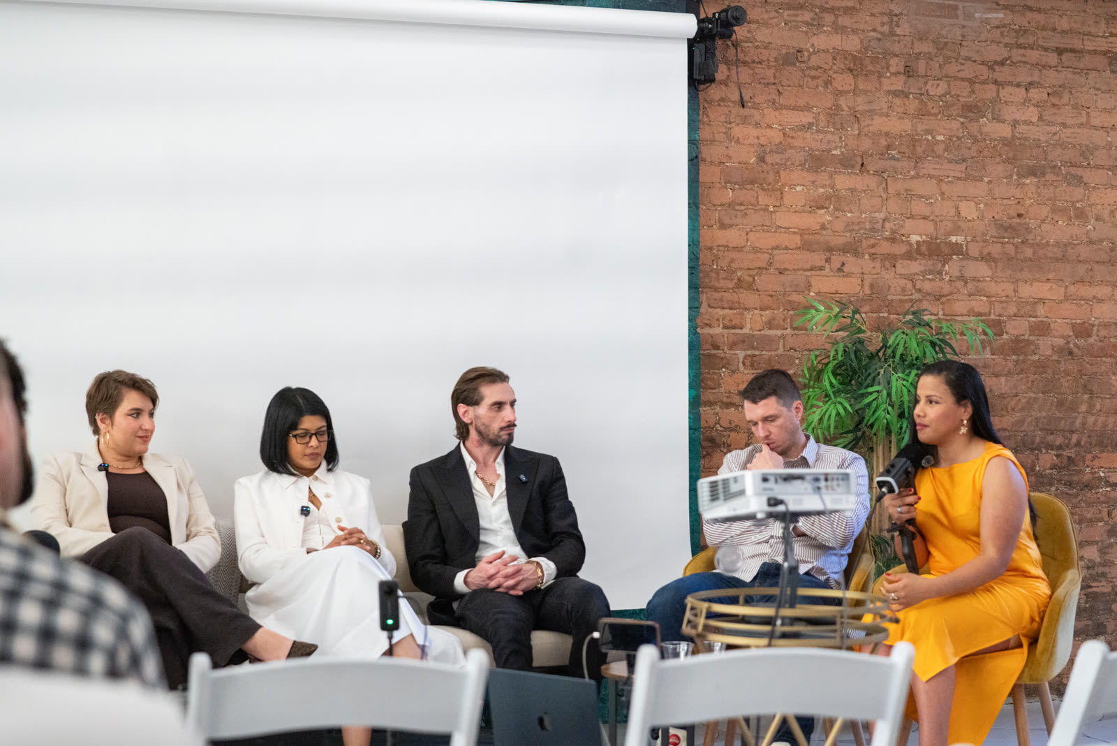 Close-up of speakers on stage during the Impact Room panel